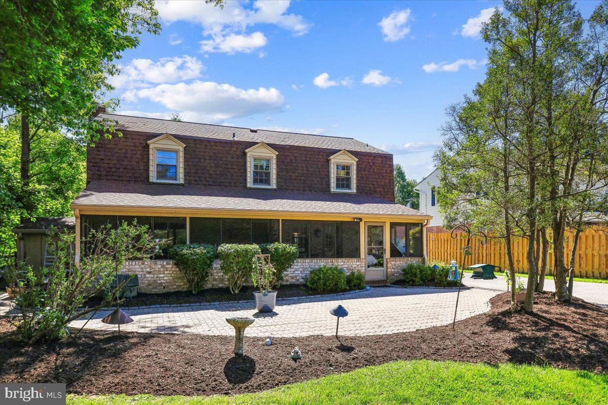 7918 Ruxway Road Towson, MD 21204 - Photo 3 of 36 a front view of a house with a yard and potted plants