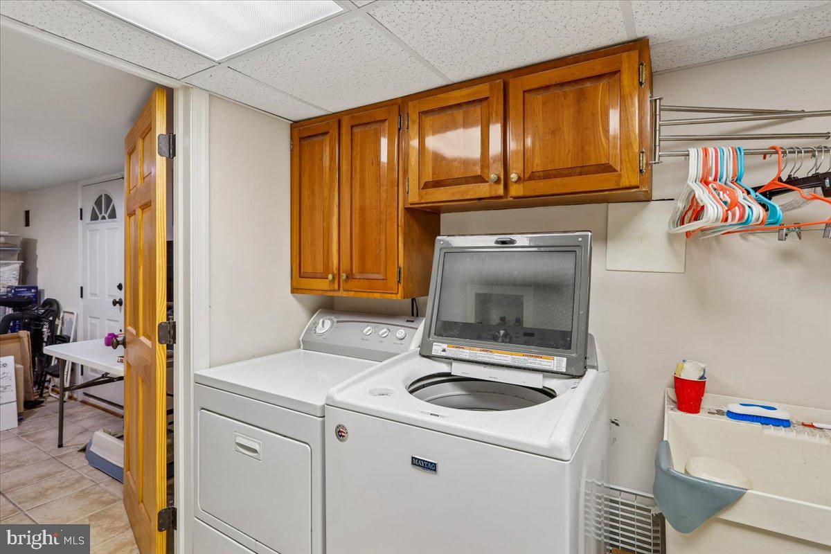 7918 Ruxway Road Towson, MD 21204 - Photo 34 of 36 a kitchen with a sink stove and cabinets