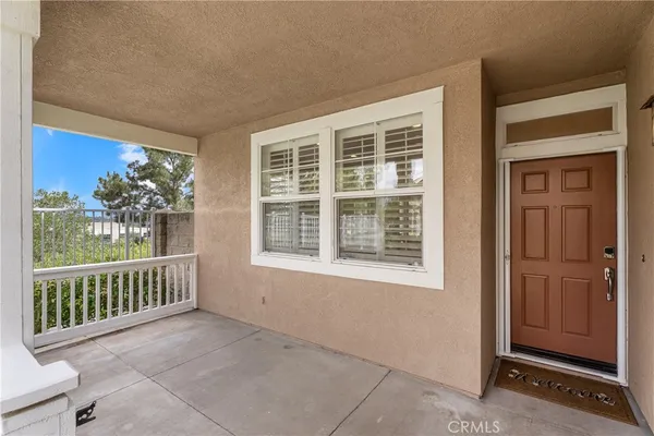 a view of a porch and a yard