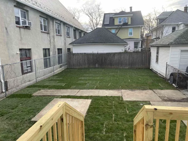 a view of a backyard of the house