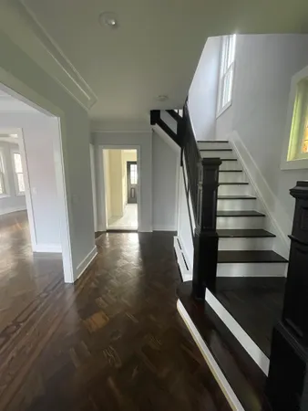 a view of entryway with wooden floor