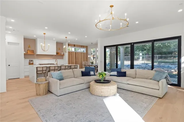 a kitchen with stainless steel appliances granite countertop a sink and a stove
