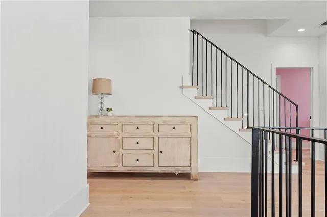 a bedroom with a bed and a chair