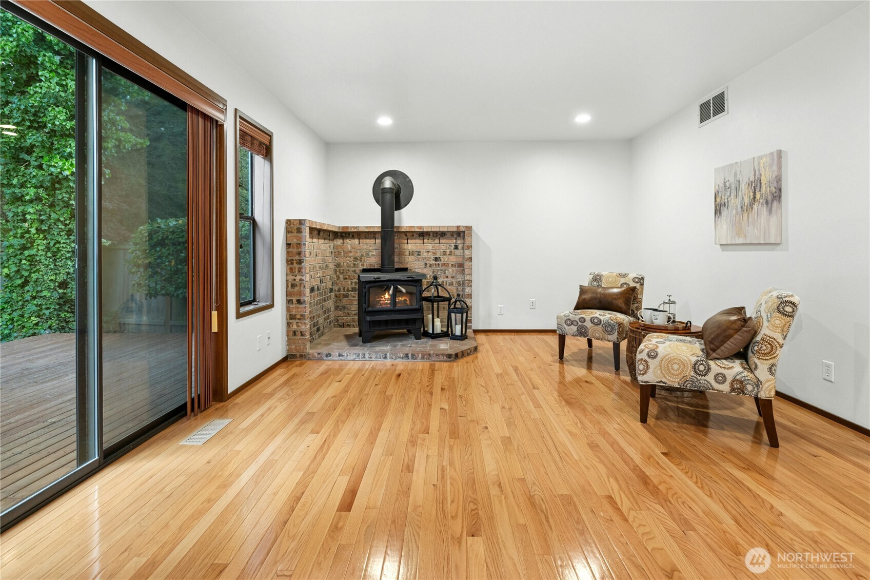 5211 103rd Street Southwest, Unit SW Mukilteo, WA 98275 - Photo 15 of 40 a living room with furniture and a fireplace