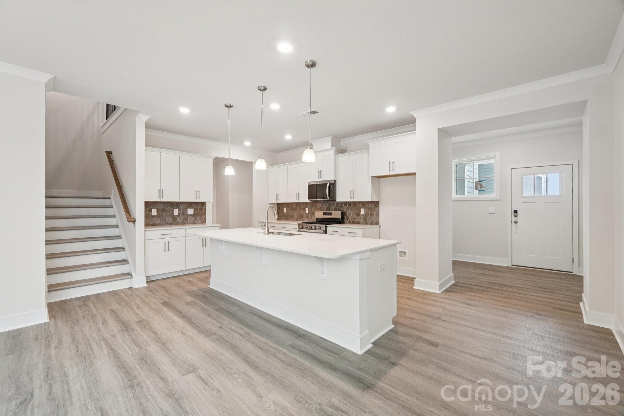 7685 Bainbridge Road Sherrills Ford, NC 28673 - Photo 11 of 33 a view of kitchen with cabinets appliances and wooden floor