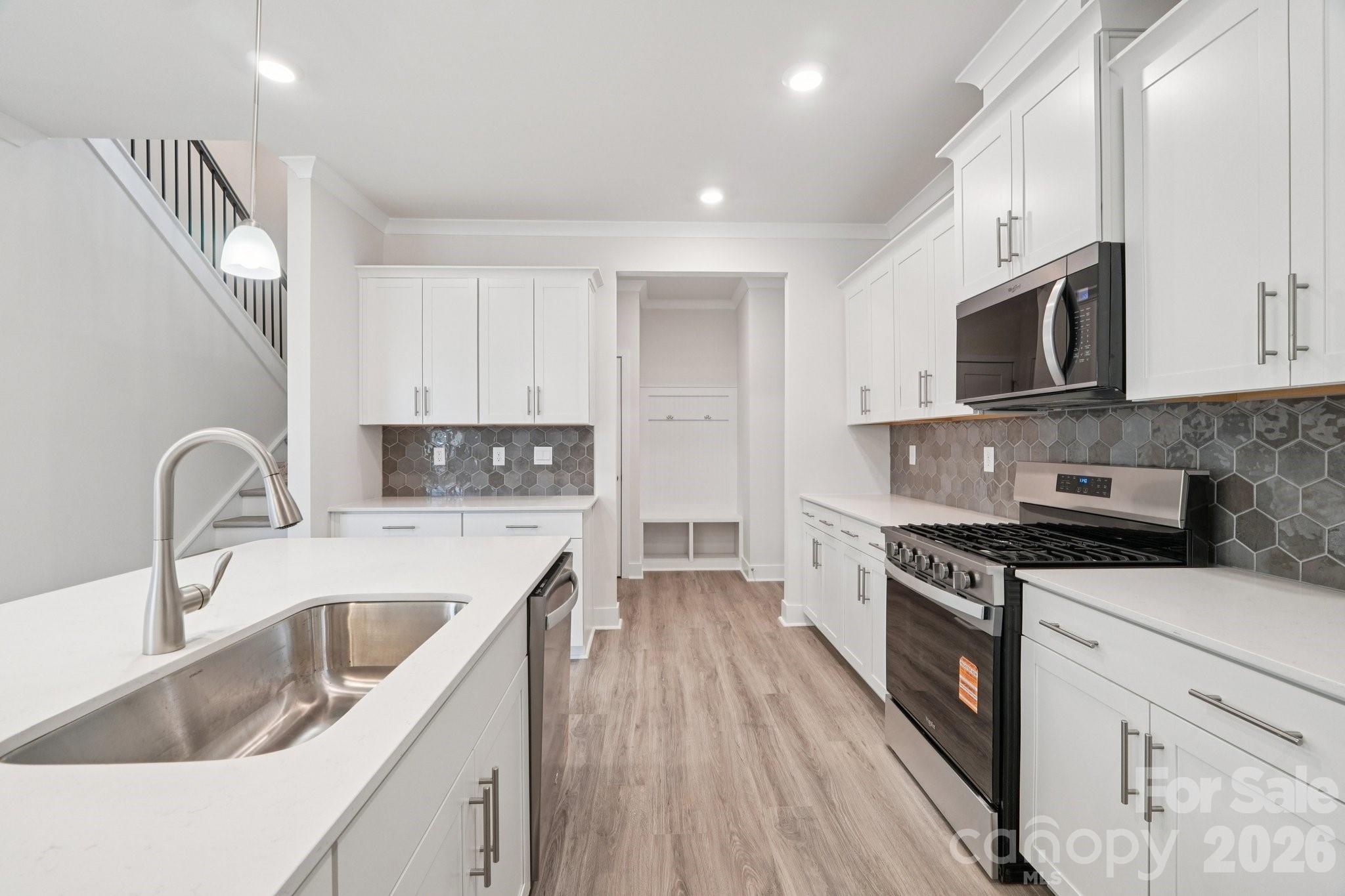 7685 Bainbridge Road Sherrills Ford, NC 28673 - Photo 13 of 33 a kitchen with stainless steel appliances granite countertop a sink stove and refrigerator