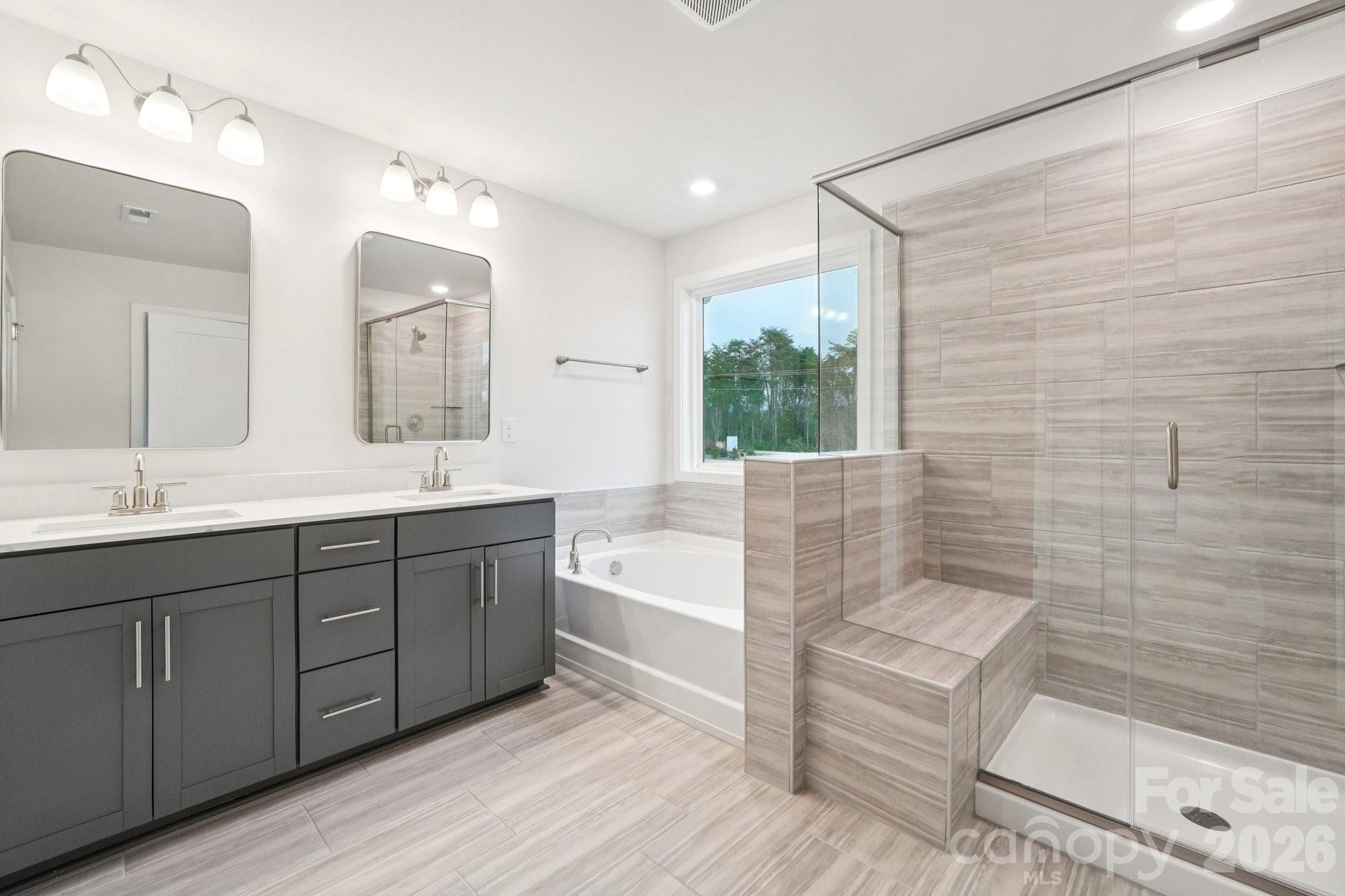 7685 Bainbridge Road Sherrills Ford, NC 28673 - Photo 22 of 33 a spacious bathroom with double vanity and a bathtub
