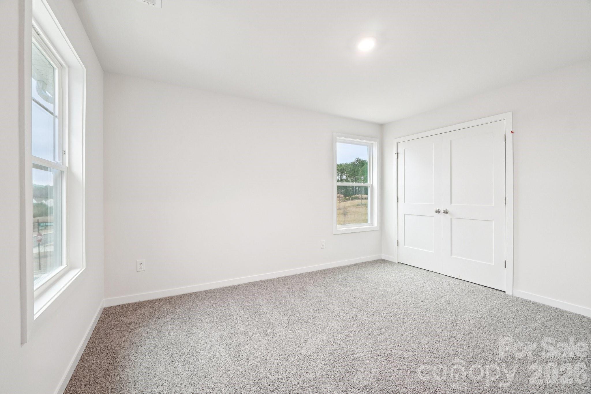7685 Bainbridge Road Sherrills Ford, NC 28673 - Photo 28 of 33 an empty room with windows and closet