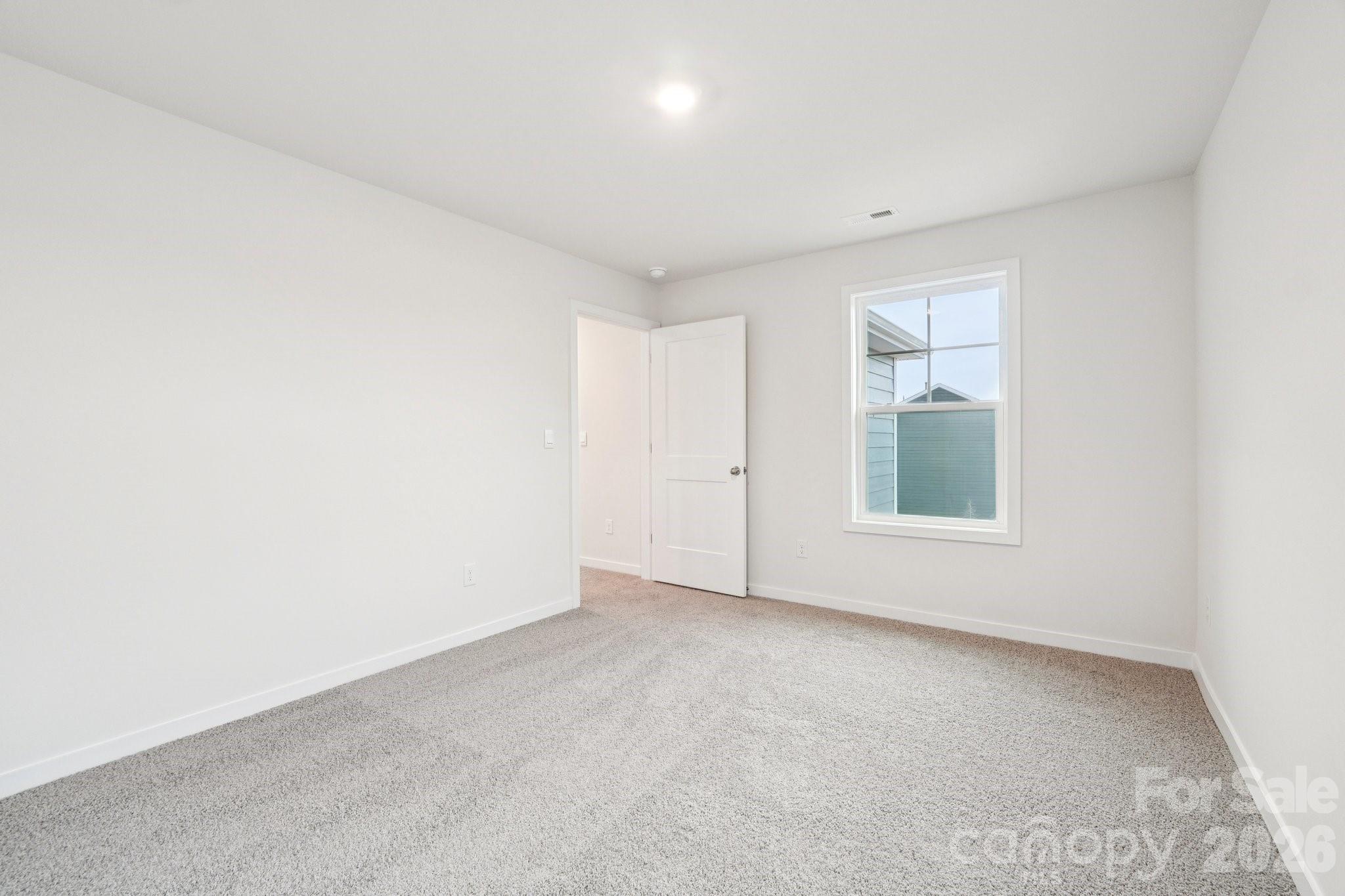 7685 Bainbridge Road Sherrills Ford, NC 28673 - Photo 29 of 33 an empty room with windows