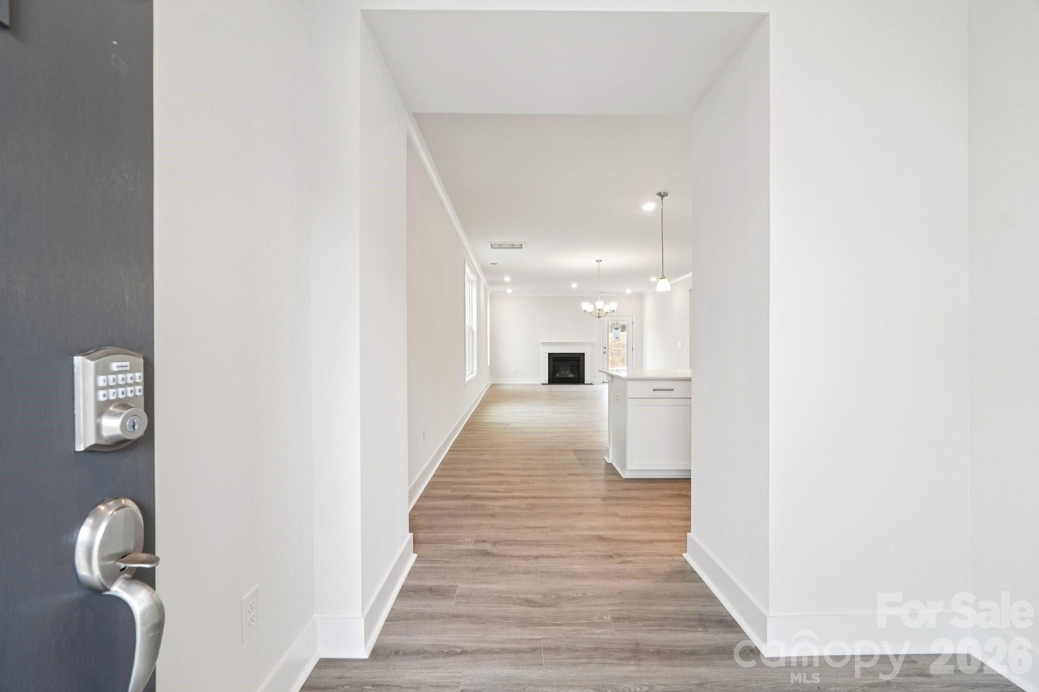 7685 Bainbridge Road Sherrills Ford, NC 28673 - Photo 3 of 33 a view of a hallway with wooden floor