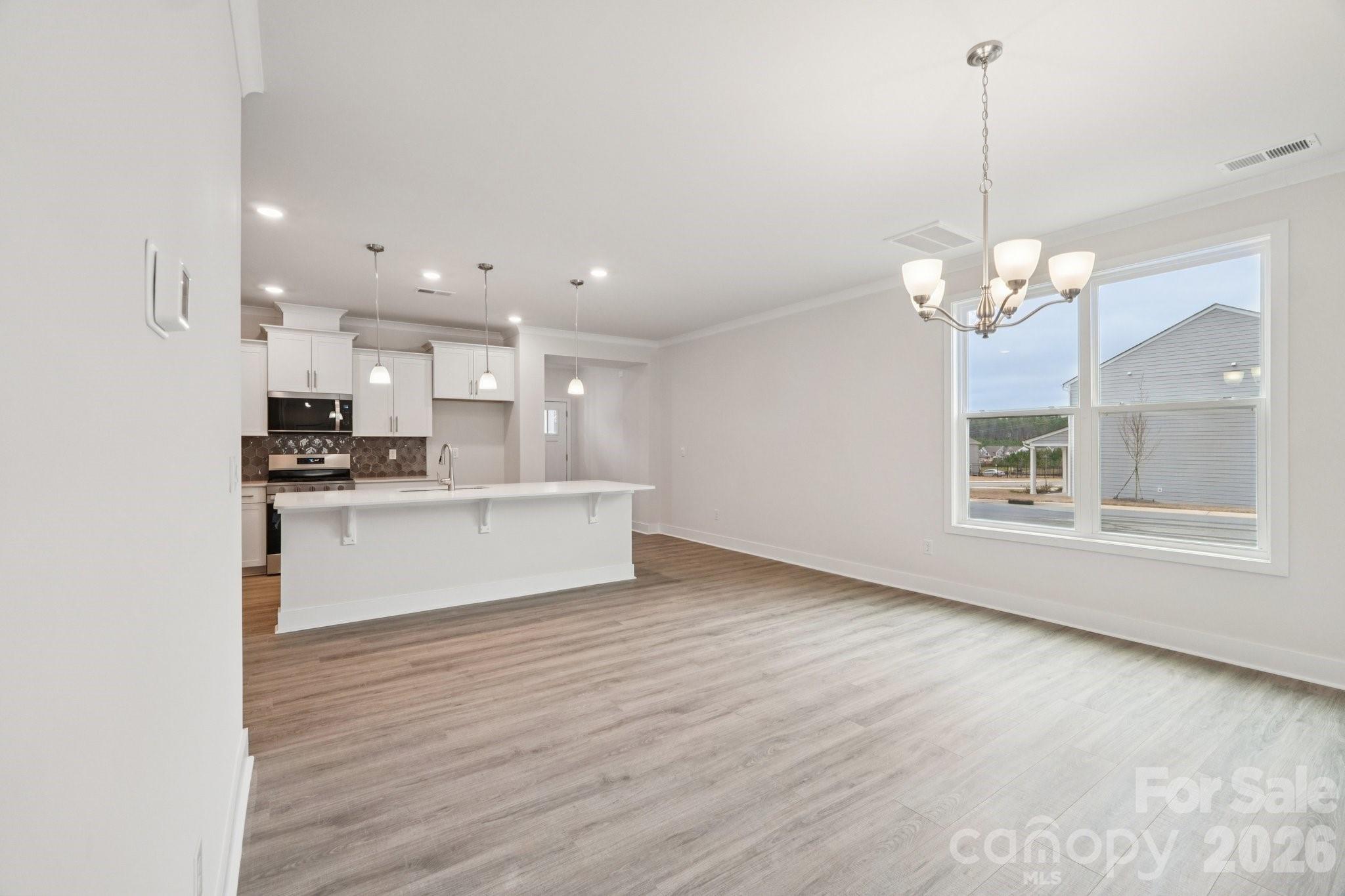 7685 Bainbridge Road Sherrills Ford, NC 28673 - Photo 9 of 33 a view of kitchen with granite countertop cabinets and refrigerator