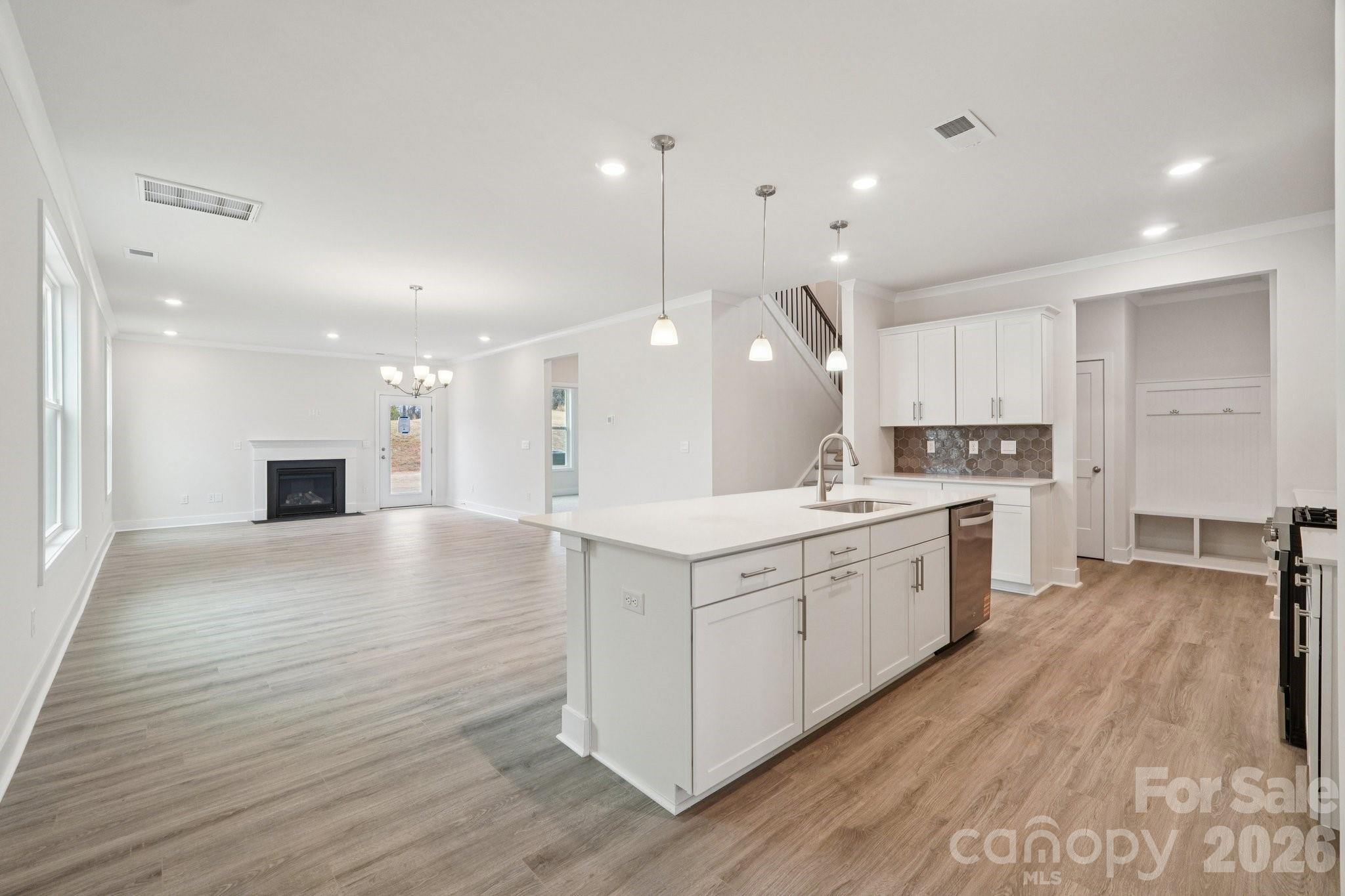 7685 Bainbridge Road Sherrills Ford, NC 28673 - Photo 10 of 33 a large kitchen with granite countertop a large counter top a sink stainless steel appliances and cabinets