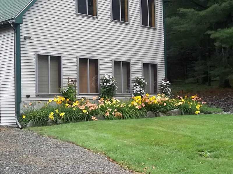 247 Mingo Loop Road Rangeley, ME 04970 - Photo 32 of 34 Exterior Front. Three bay garage...