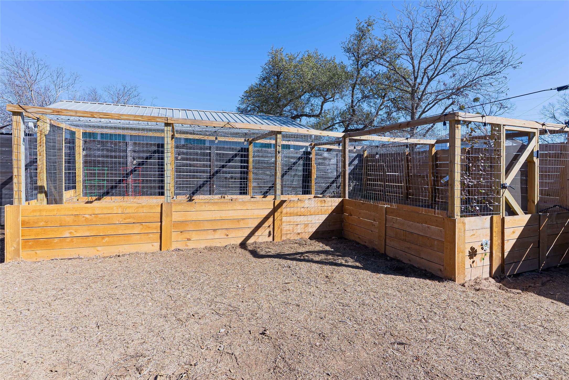 11010 3rd Street Jonestown, TX 78645 - Photo 17 of 20 Backyard space featuring garden beds and room to enjoy outdoor living