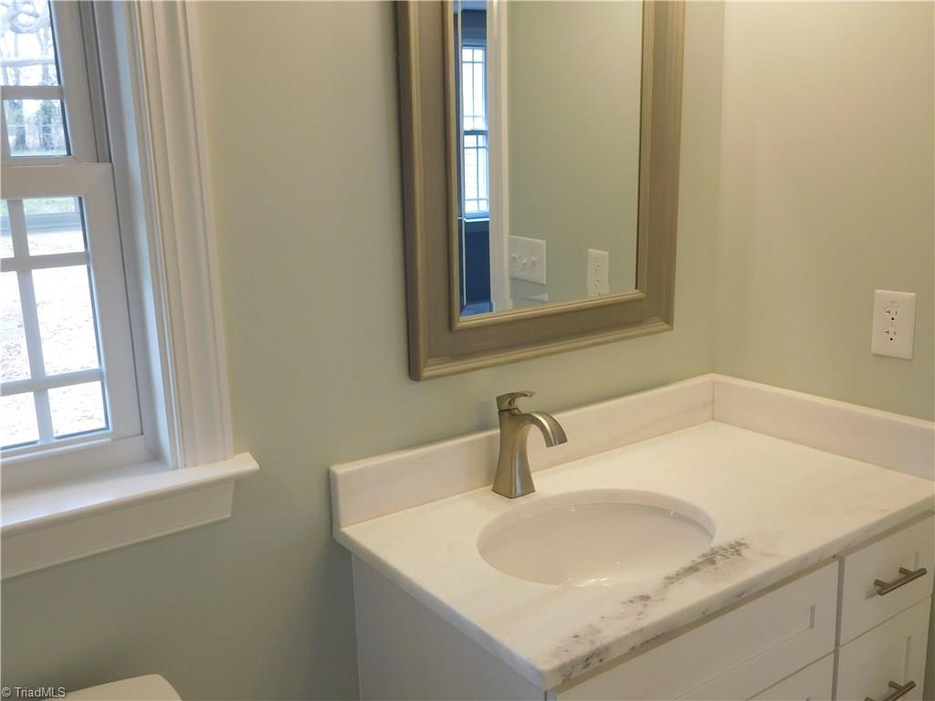 261 Jones Road Winston-Salem, NC 27107 - Photo 19 of 28 2 Separate granite top vanities. Window provides natural light.