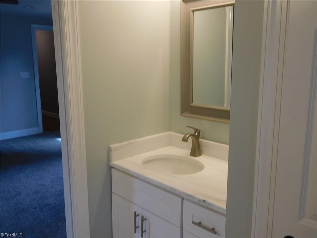261 Jones Road Winston-Salem, NC 27107 - Photo 20 of 28 2nd Vanity and linen closet for even more storage. Beautiful Bathroom!