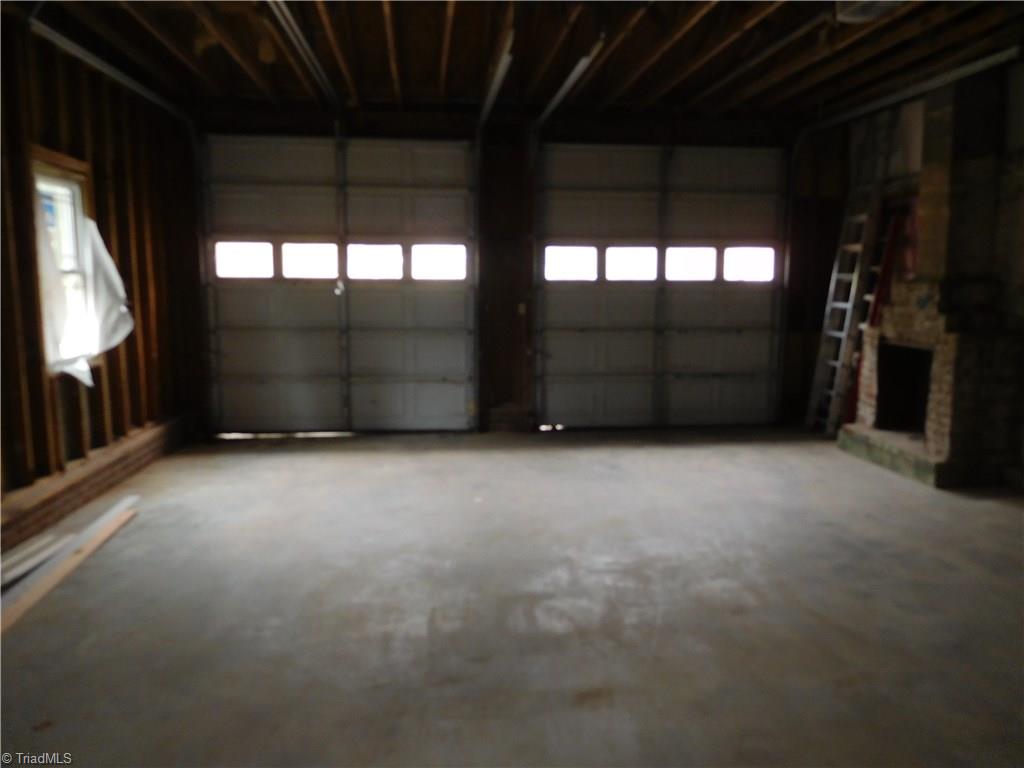 261 Jones Road Winston-Salem, NC 27107 - Photo 23 of 28 This garage is absolutely huge so no need to complain about storage space. 30' x 24' Garage w/10'tall x 9' wide garage doors (park RV's, extra tall trucks, Boats).