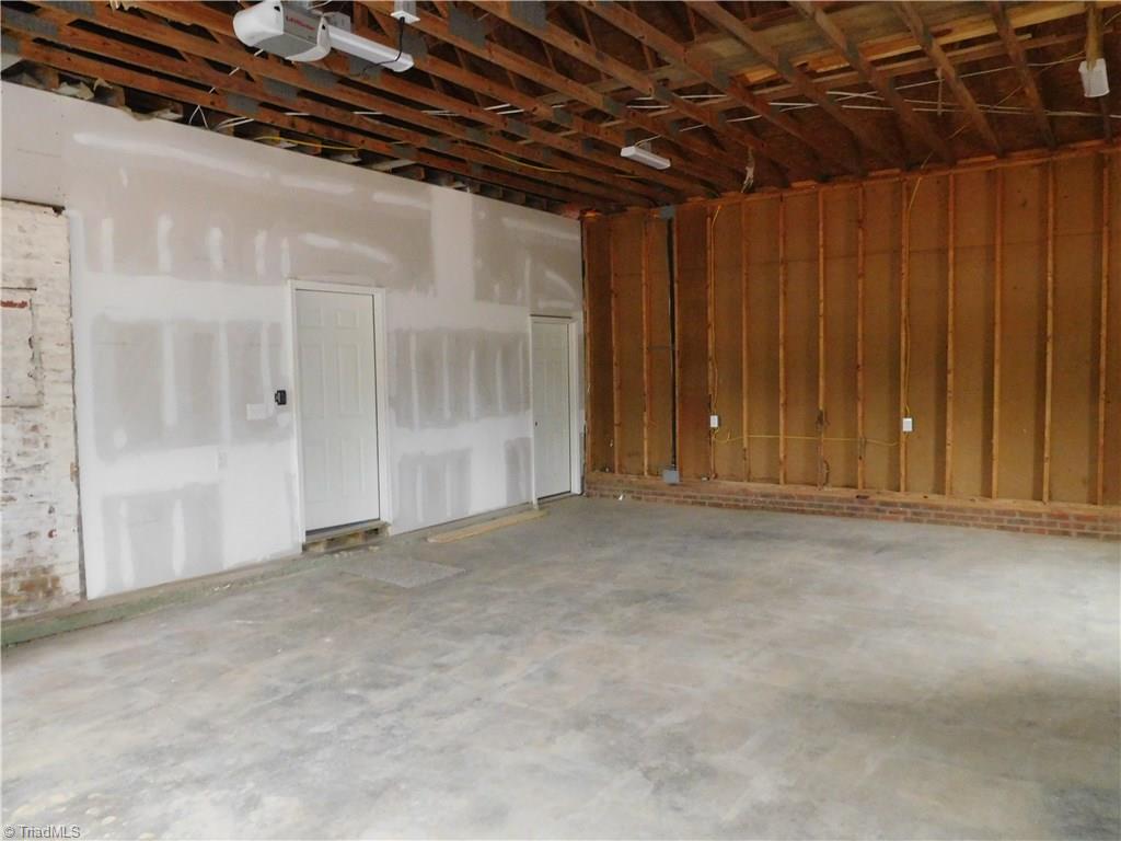 261 Jones Road Winston-Salem, NC 27107 - Photo 24 of 28 Super Clean HUGE Garage! One door leads into the home and the other leads to the basement. There is so much space in this Garage!