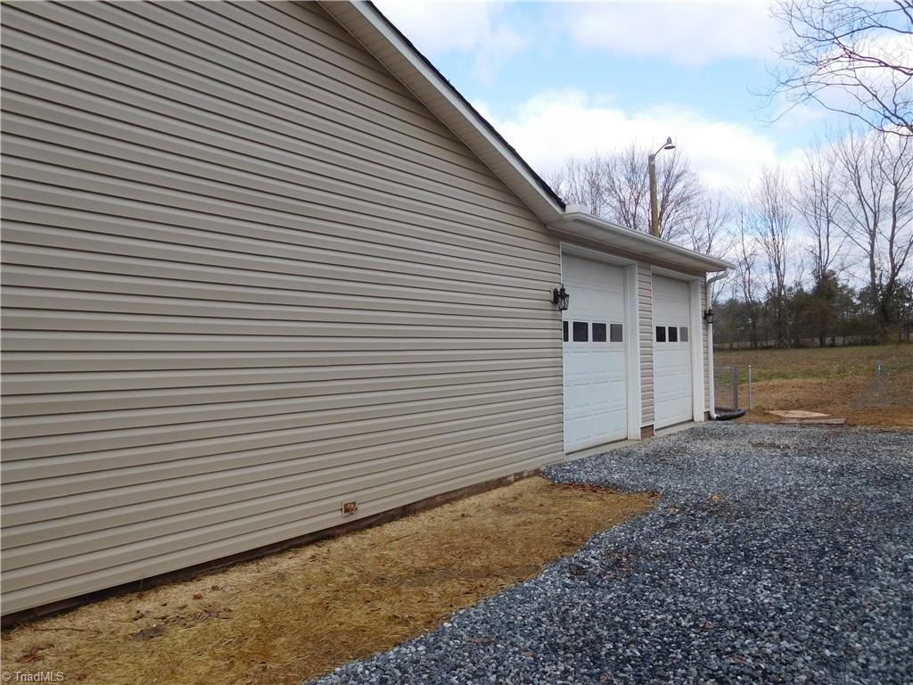 261 Jones Road Winston-Salem, NC 27107 - Photo 25 of 28 Side of home. Driveway enters from Jones Rd and side street. Double Car attached garage.