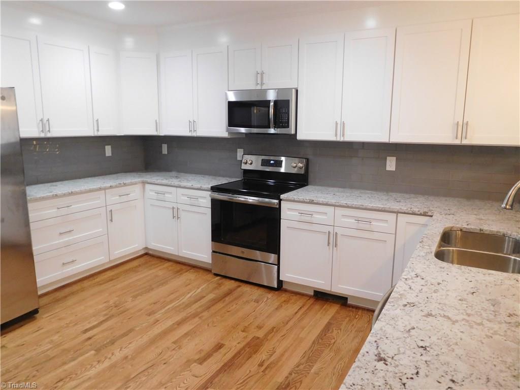 Kitchen:  Beautiful bright white cabinets, granite counters & tile backsplash.  There is a ton of workspace.  Full Stainless Steel appliance package.  Built-in MW, DW, Range/Oven & Refrigerator.