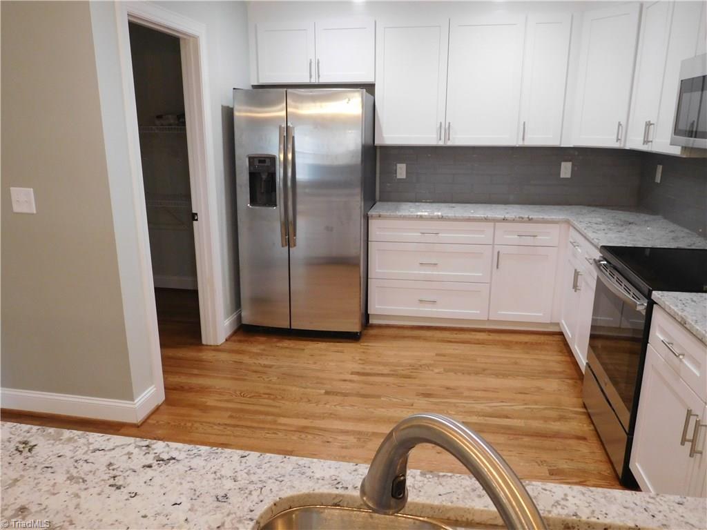 261 Jones Road Winston-Salem, NC 27107 - Photo 8 of 28 Tons of workspace! Large walk-in Pantry to the L of the Fridge.