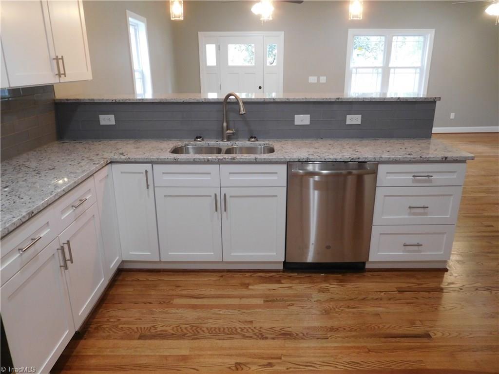 261 Jones Road Winston-Salem, NC 27107 - Photo 9 of 28 Bar Height eat-at peninsula. This gives you plenty of dining space & options. Great for entertaining. To the Right of the Kitchen is a large walk-in Pantry.