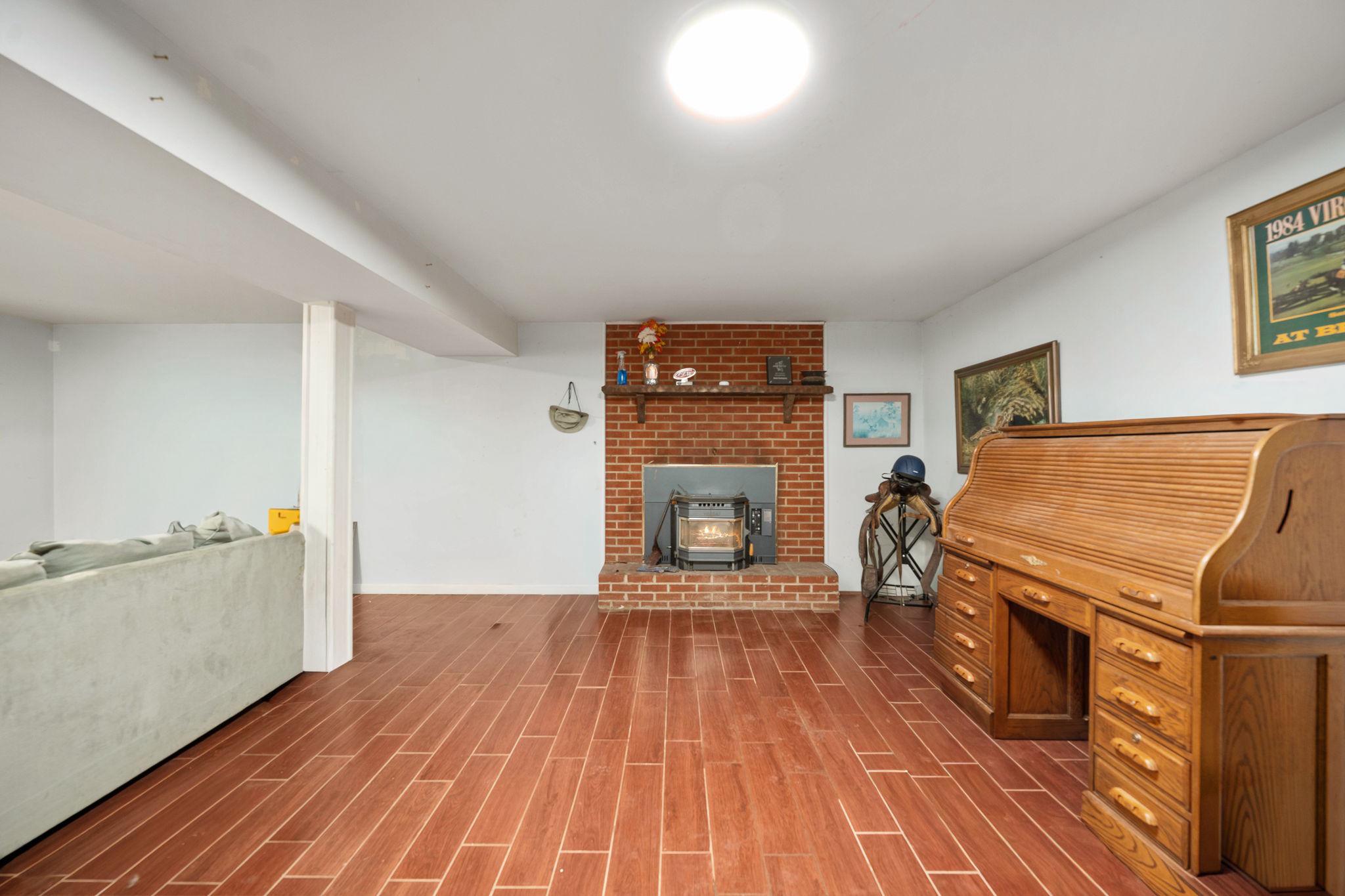 60 Richards Ferry Road Fredericksburg, VA 22406 - Photo 23 of 41 Beautiful tile flooring, fireplace w woodstove