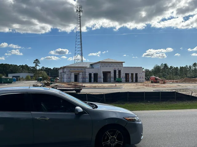a view of a patio with swimming pool table and chairs