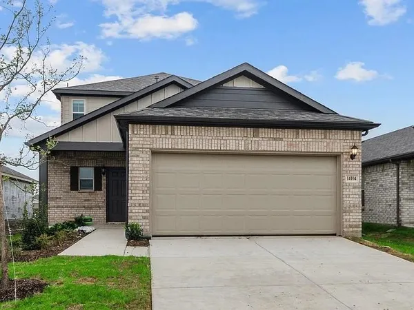 a front view of a house with garage
