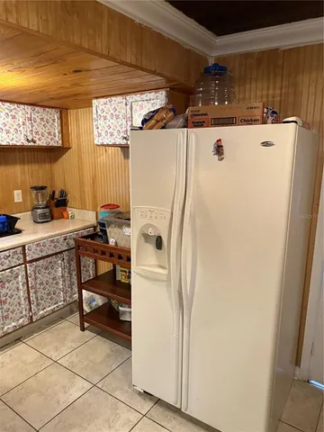 a white refrigerator freezer sitting in a kitchen
