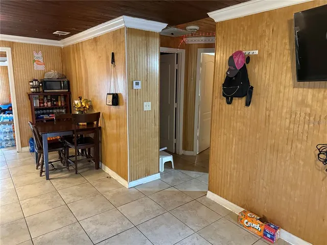 a view of dining room with furniture and entryway