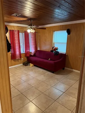 a living room with furniture and a window