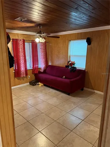a living room with furniture and a window