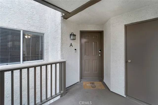 a view of a porch with wooden floor