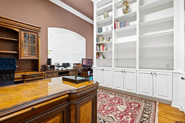 a view of hallway with wooden floor