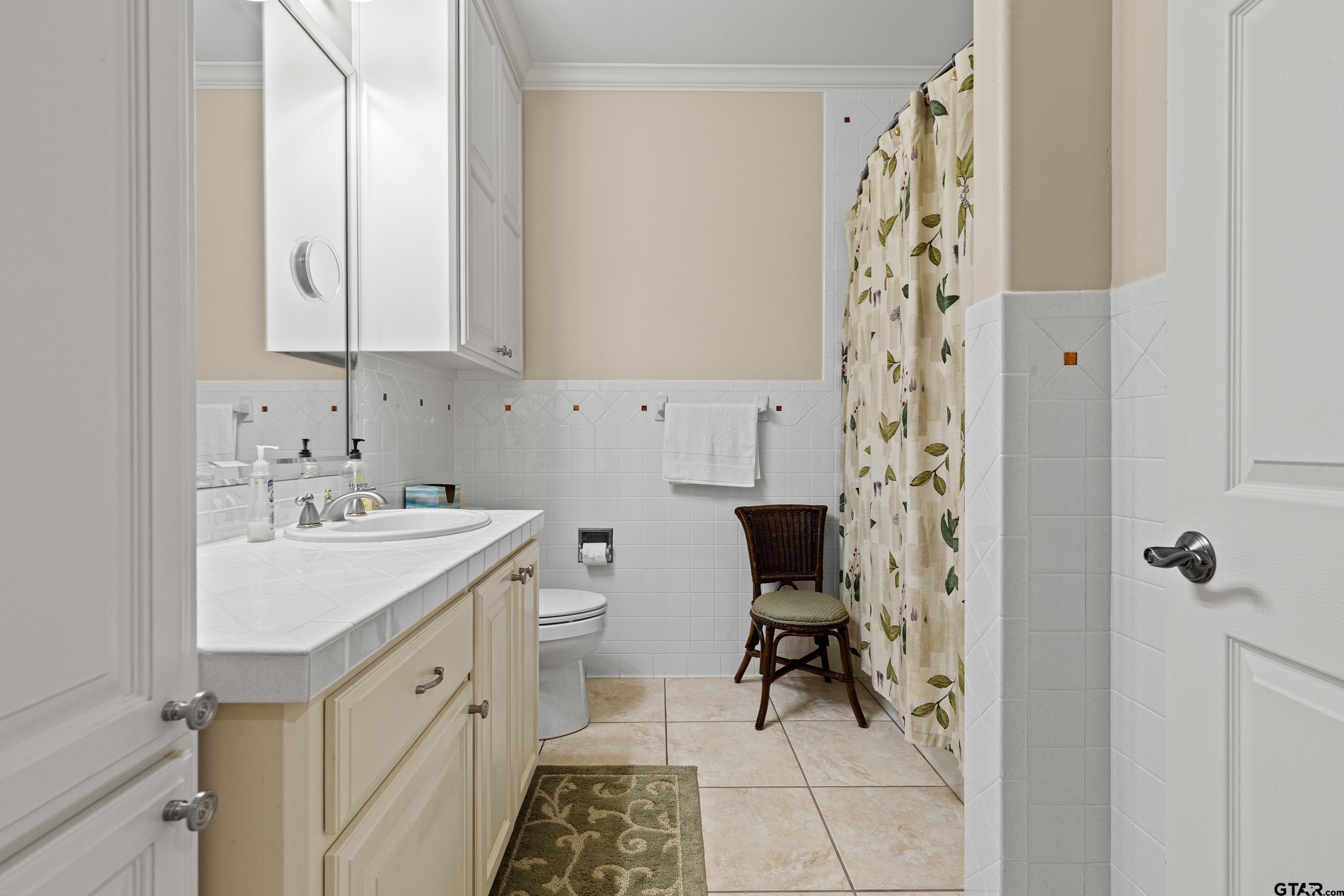 1360 East Main Street Henderson, TX 75652 - Photo 37 of 48 a kitchen with a sink and a refrigerator
