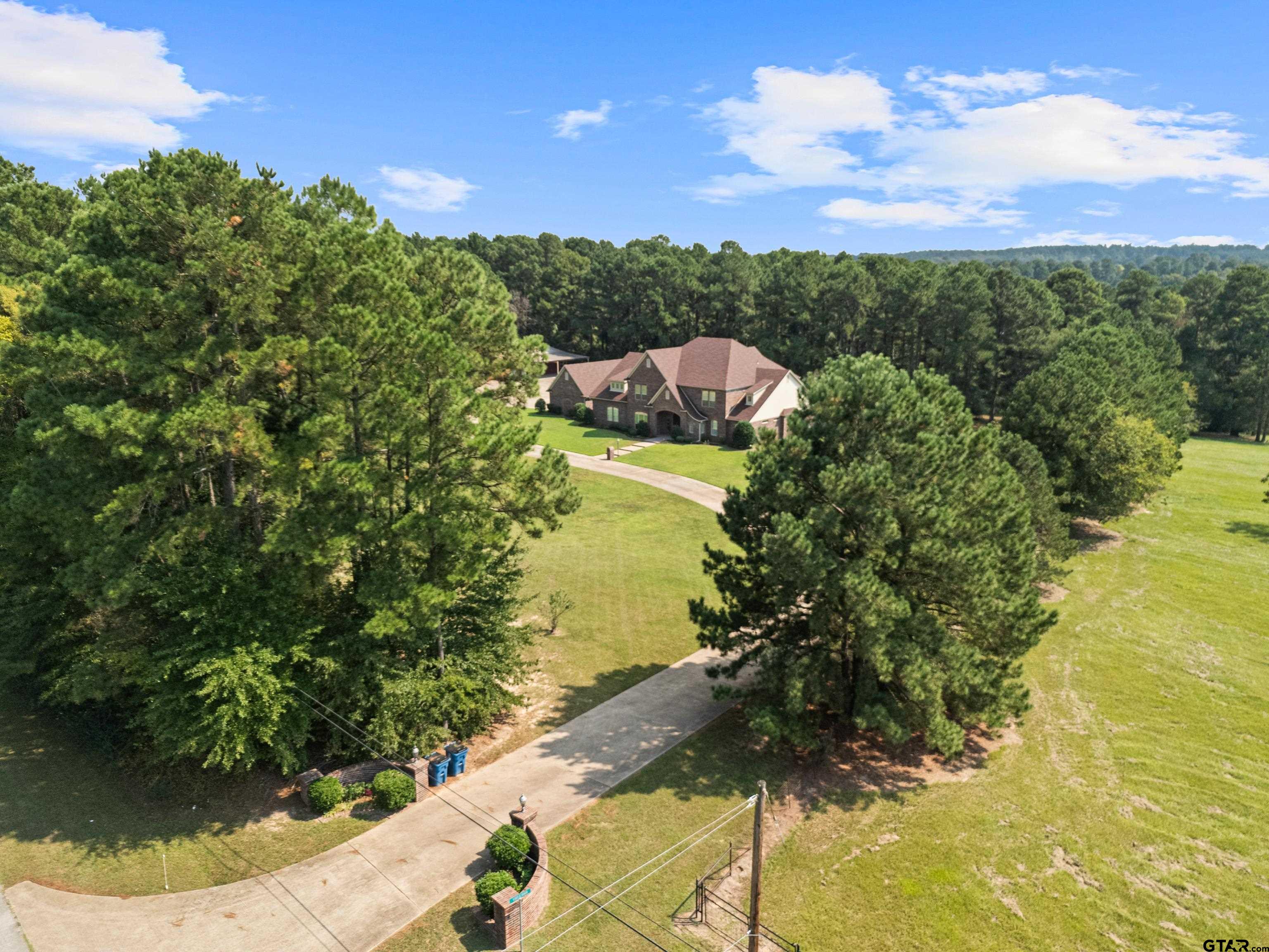 1360 East Main Street Henderson, TX 75652 - Photo 4 of 48 a view of a lake from a yard