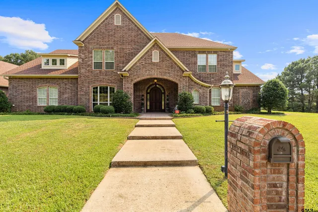 a front view of a house with yard