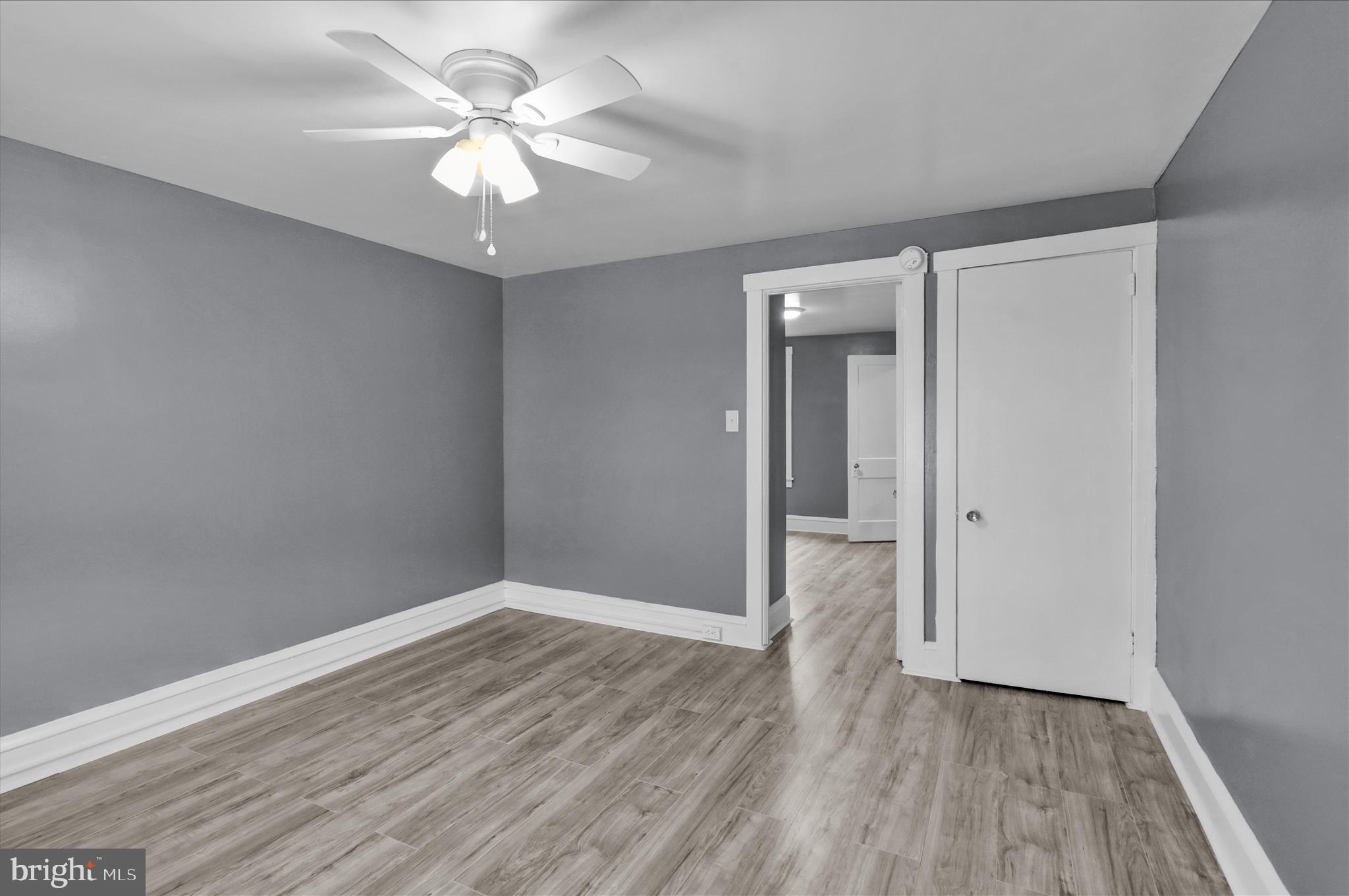 1409 Church Street Reading, PA 19601 - Photo 22 of 23 wooden floor in an empty room with a window