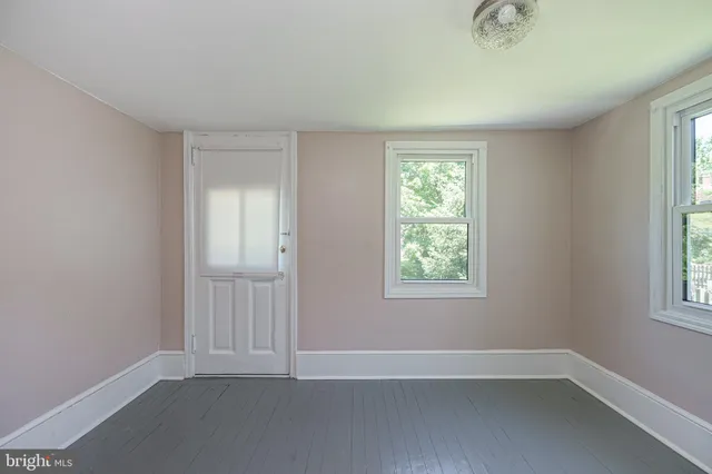 an empty room with windows