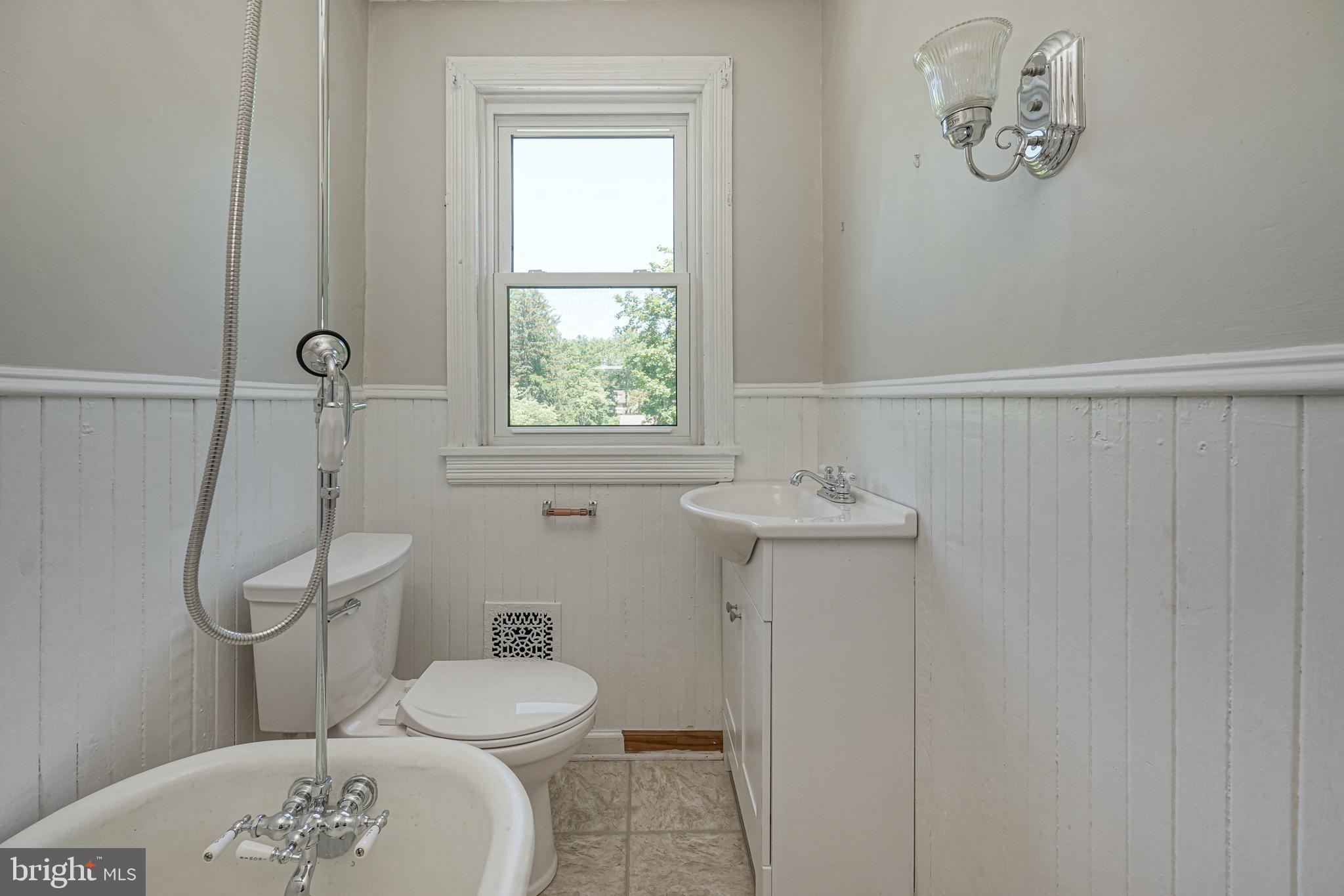343 West 2nd Street Moorestown, NJ 08057 - Photo 12 of 31 a bathroom with a toilet a sink and mirror
