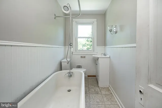 a bathroom with a bathtub and sink