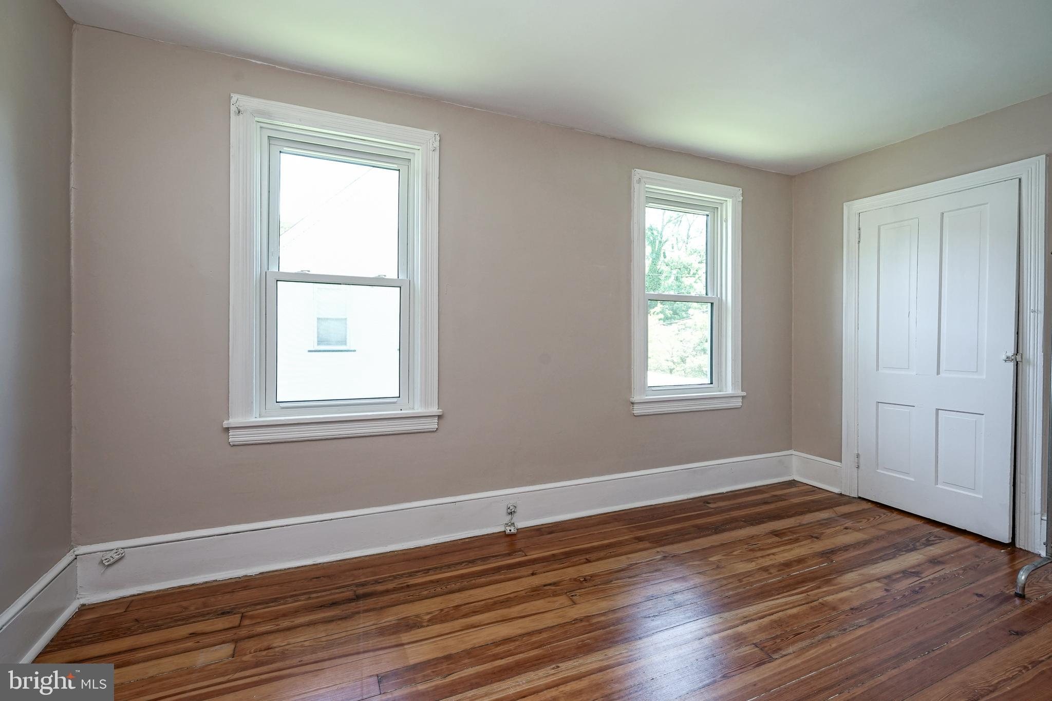 343 West 2nd Street Moorestown, NJ 08057 - Photo 16 of 31 an empty room with wooden floor and windows