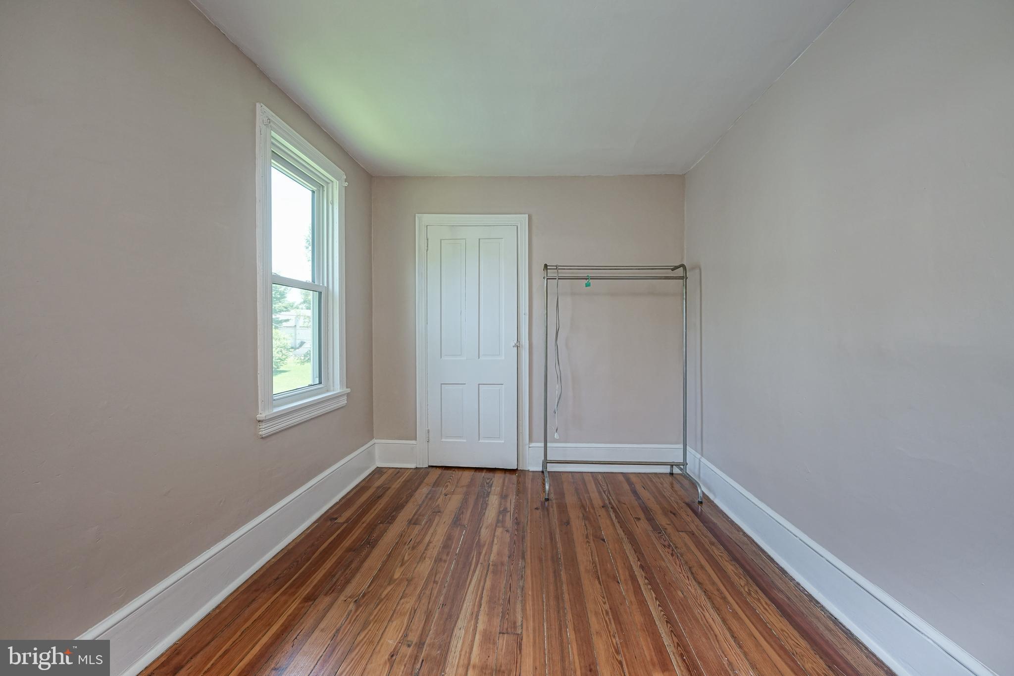 343 West 2nd Street Moorestown, NJ 08057 - Photo 17 of 31 an empty room with wooden floor and windows