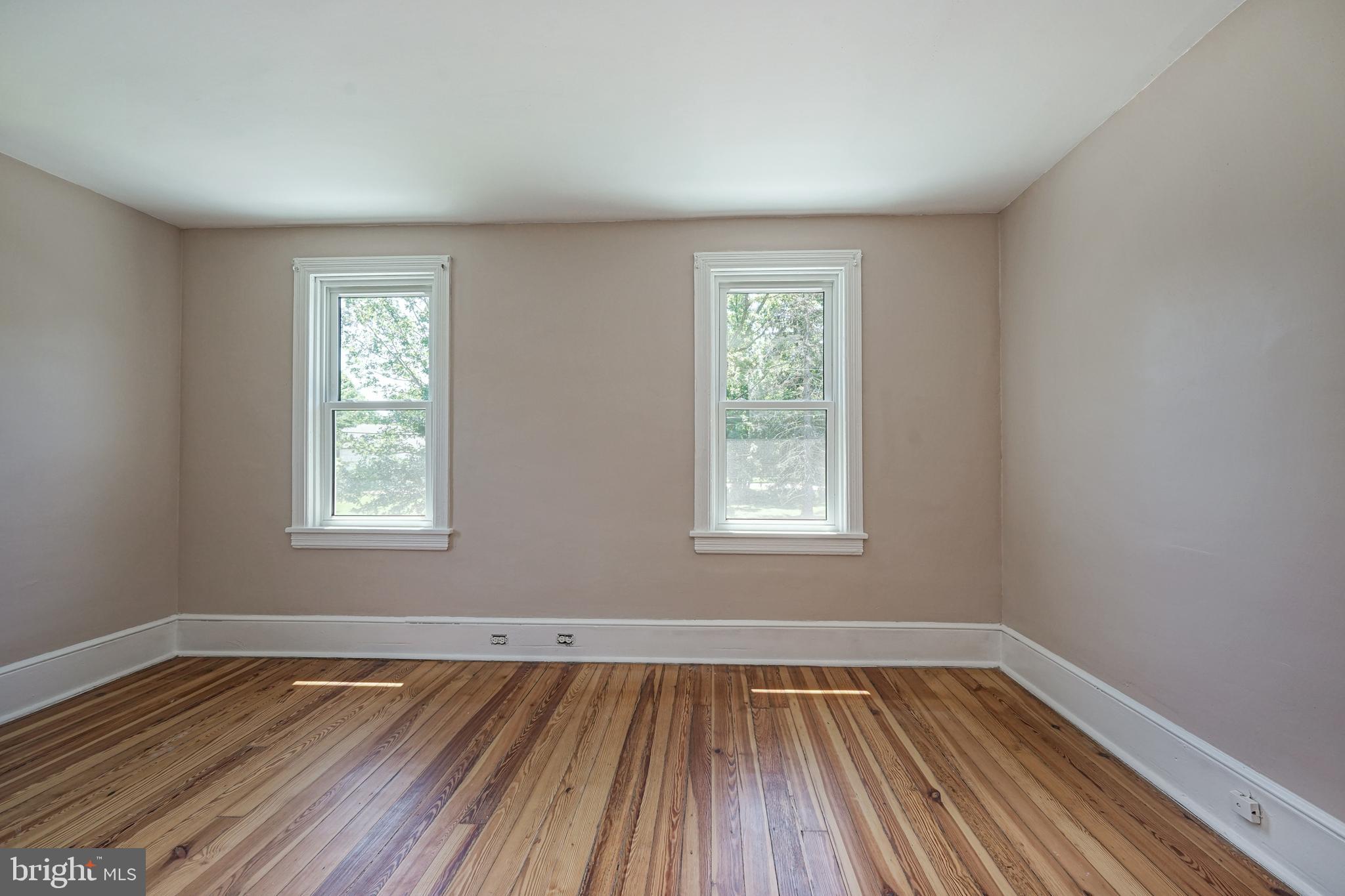 343 West 2nd Street Moorestown, NJ 08057 - Photo 20 of 31 a view of an empty room with wooden floor and a window