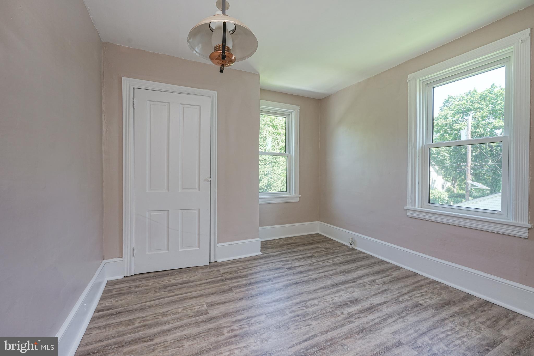 343 West 2nd Street Moorestown, NJ 08057 - Photo 26 of 31 a view of an empty room with wooden floor and a window