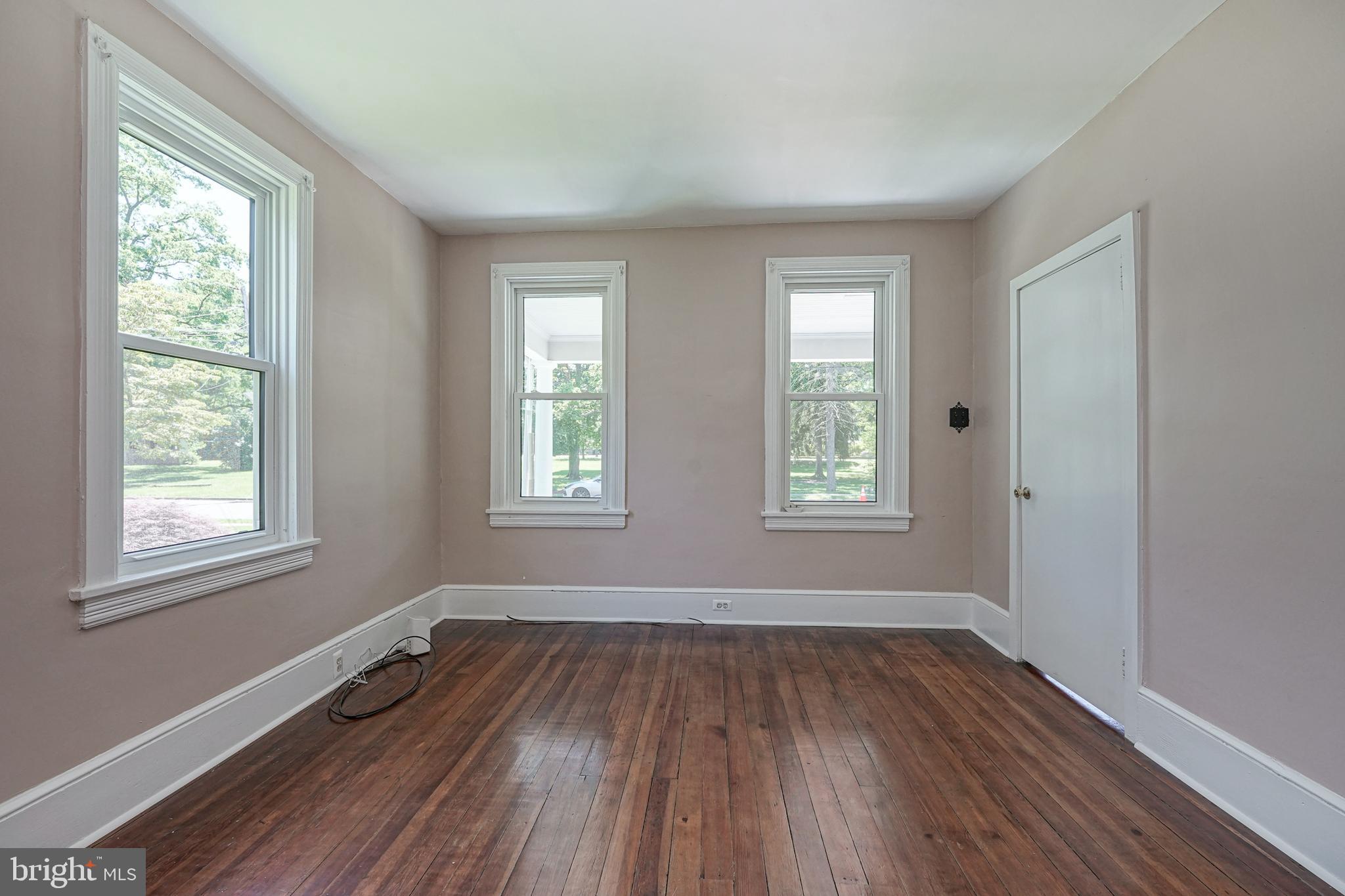 343 West 2nd Street Moorestown, NJ 08057 - Photo 3 of 31 a view of an empty room with wooden floor and a window