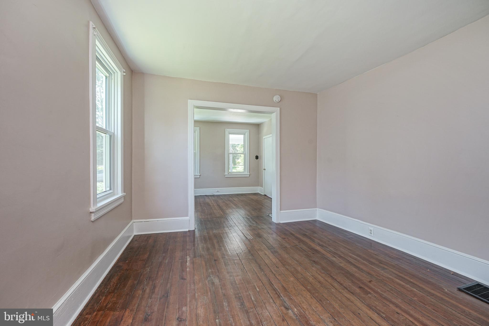 343 West 2nd Street Moorestown, NJ 08057 - Photo 5 of 31 a view of an empty room with wooden floor and a window
