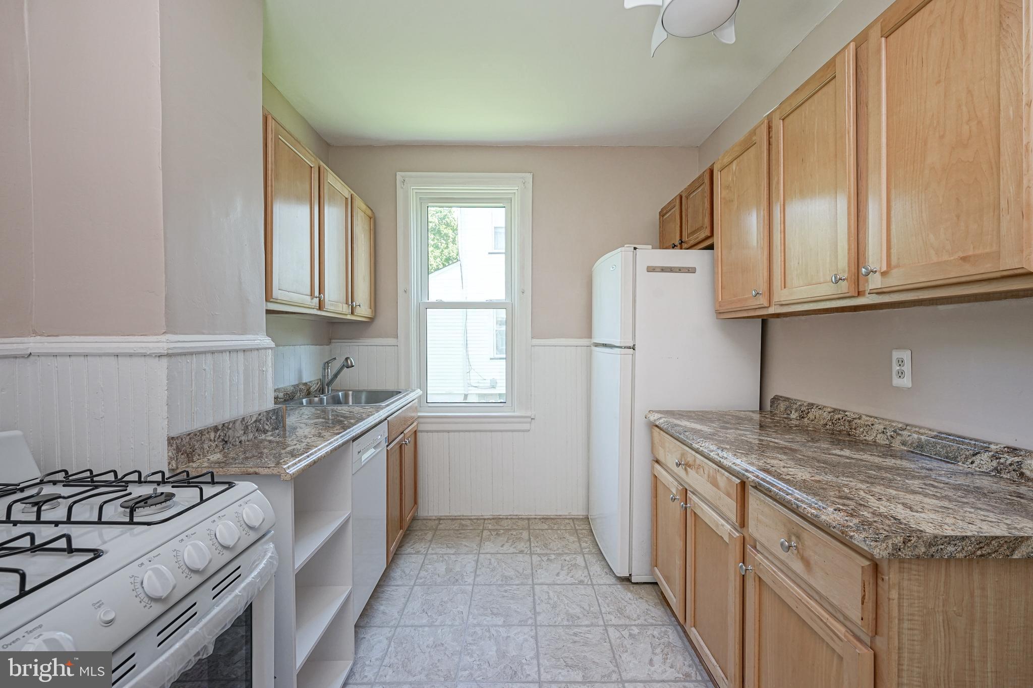 343 West 2nd Street Moorestown, NJ 08057 - Photo 8 of 31 a kitchen with granite countertop a sink stove and refrigerator