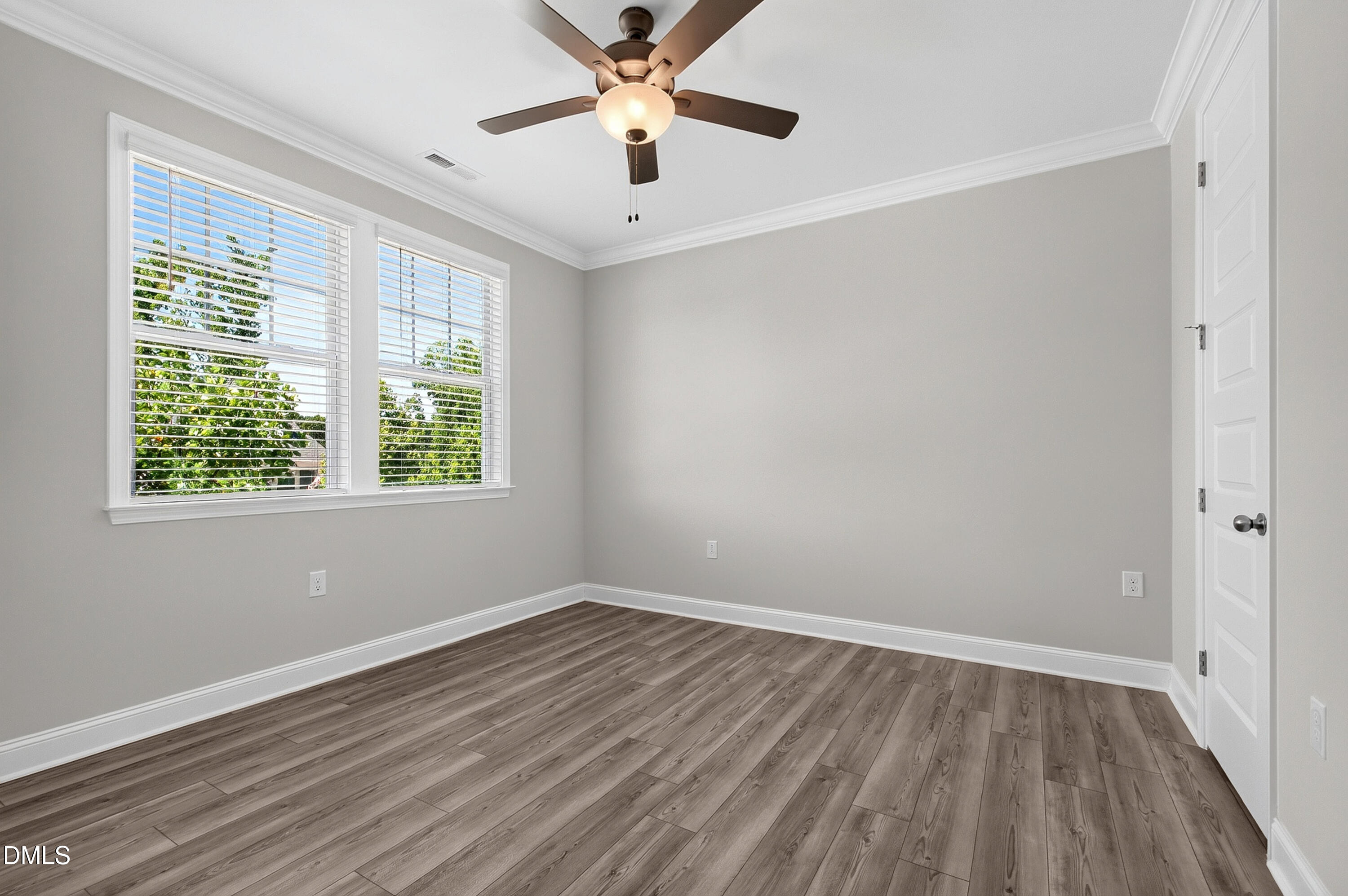 1300 Commons Ford Place Apex, NC 27539 - Photo 38 of 70 wooden floor in an empty room with a window